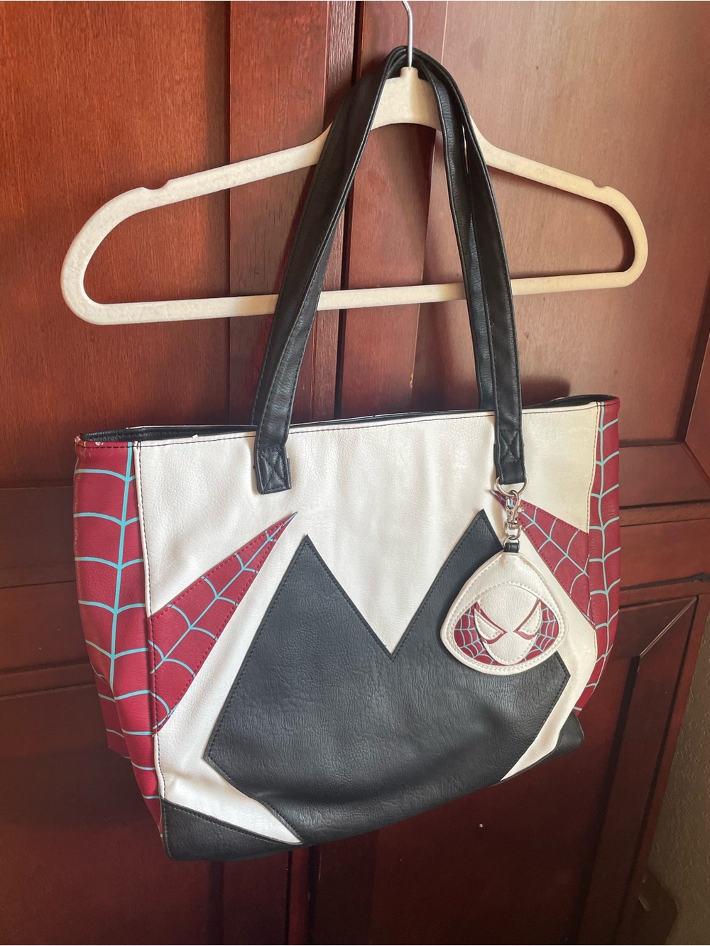 Loungefly Marvel Spider-Gwen tote bag with spiderweb pattern, bag charm